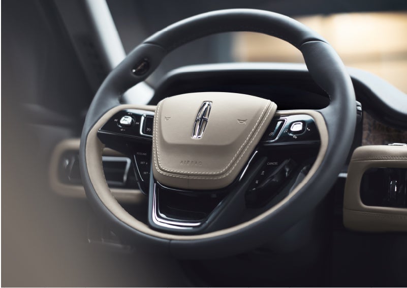 The intuitively placed controls of the steering wheel on a 2023 Lincoln Aviator® SUV | Lincoln of Wayne in Wayne NJ