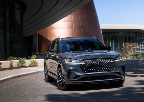 A gray 2025 Lincoln Aviator® SUV is parked outside a modern building with the sun shining. | Lincoln of Wayne in Wayne NJ