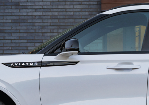 The driver’s door of a white 2025 Lincoln Aviator® SUV is showcased. | Lincoln of Wayne in Wayne NJ