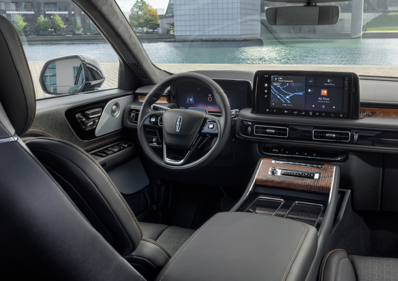 The interior of the 2025 Lincoln Aviator® SUV is shown parked with a view of a harbor through the windshield. | Lincoln of Wayne in Wayne NJ