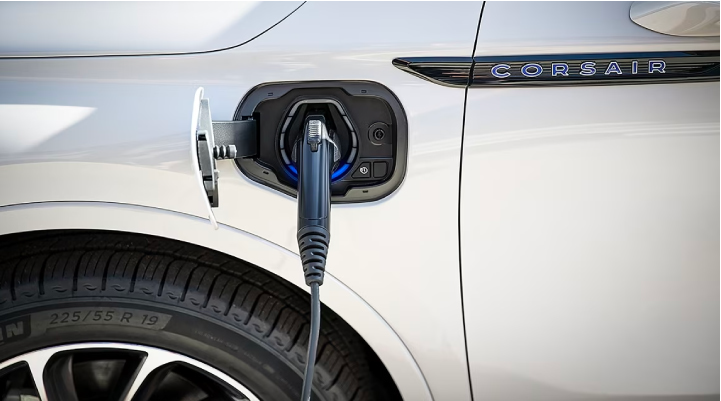 An electric charger is shown plugged into the charging port of a Lincoln Corsair® Grand Touring
model. | Lincoln of Wayne in Wayne NJ