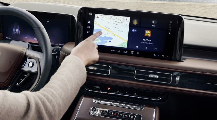 A person is tapping the center display touchscreen of a 2026 Lincoln Aviator® SUV. | Lincoln of Wayne in Wayne NJ