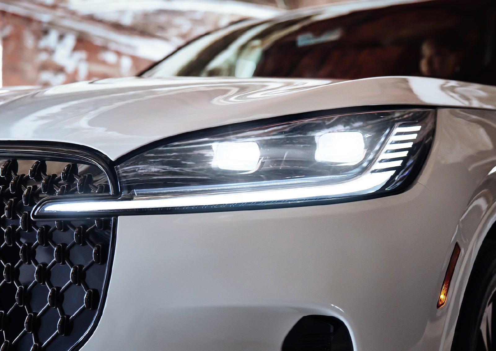 A close-up of a headlamp on the 2027 Lincoln Aviator® SUV is shown. | Lincoln of Wayne in Wayne NJ