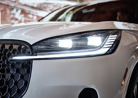 A close-up of a headlamp on the 2027 Lincoln Aviator® SUV is shown. | Lincoln of Wayne in Wayne NJ