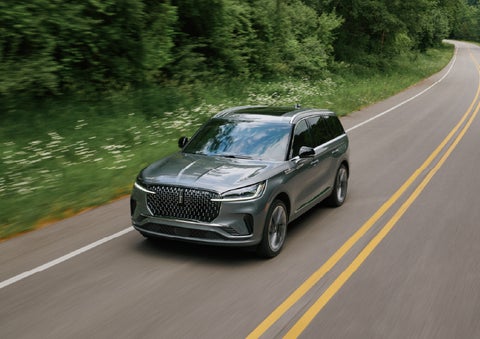 A 2027 Lincoln Aviator® SUV is being driven down a road. | Lincoln of Wayne in Wayne NJ