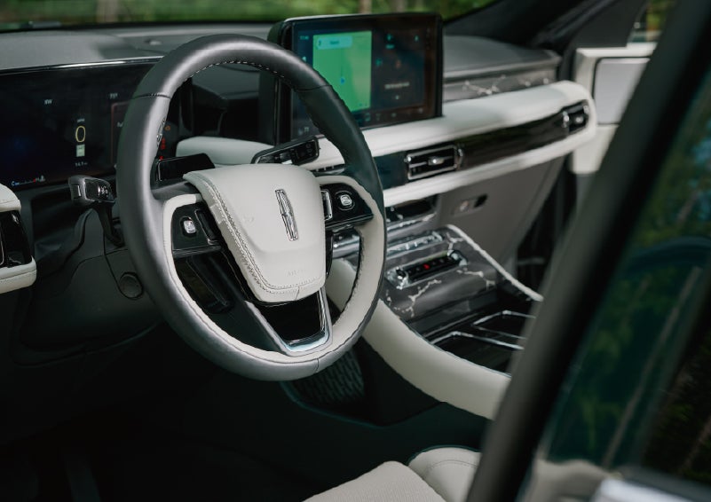 The leather-trimmed steering wheel of a 2027 Lincoln Aviator® Black Label™ SUV. | Lincoln of Wayne in Wayne NJ