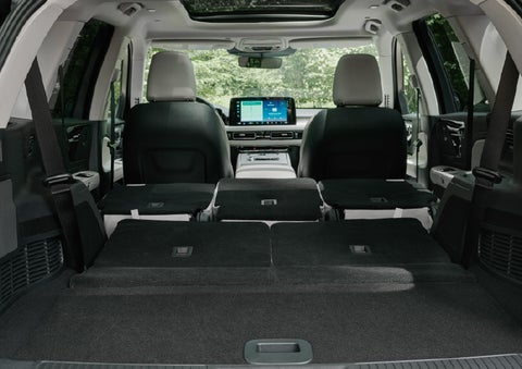 A rear to front view of the interior of a 2027 Lincoln Aviator® Black Label™ SUV shows the third and second rows folded flat | Lincoln of Wayne in Wayne NJ